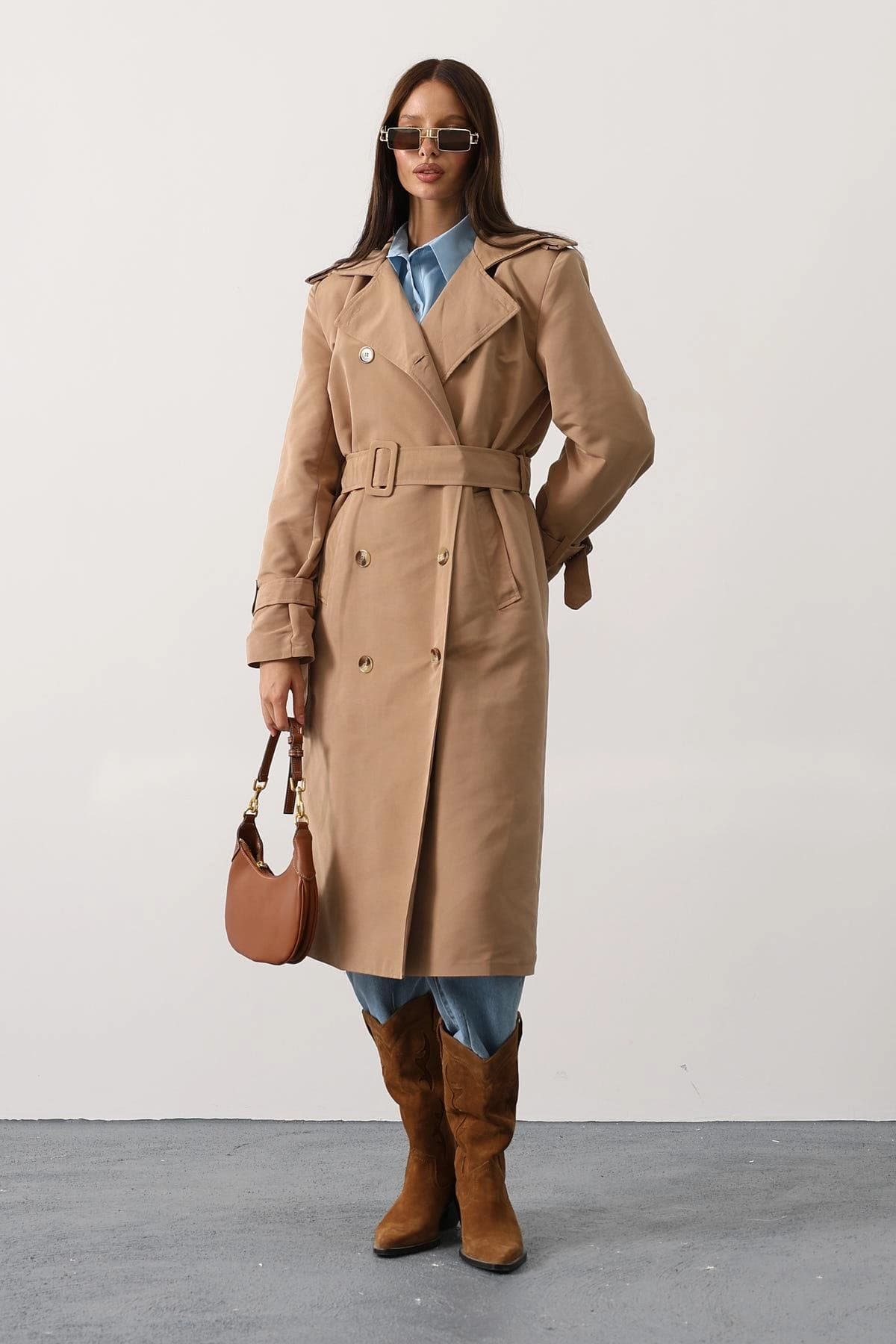 Refined camel overcoat, calf-length, with self-tie closure, multiple buttons, storm shield detailing, and sleeve cinc...