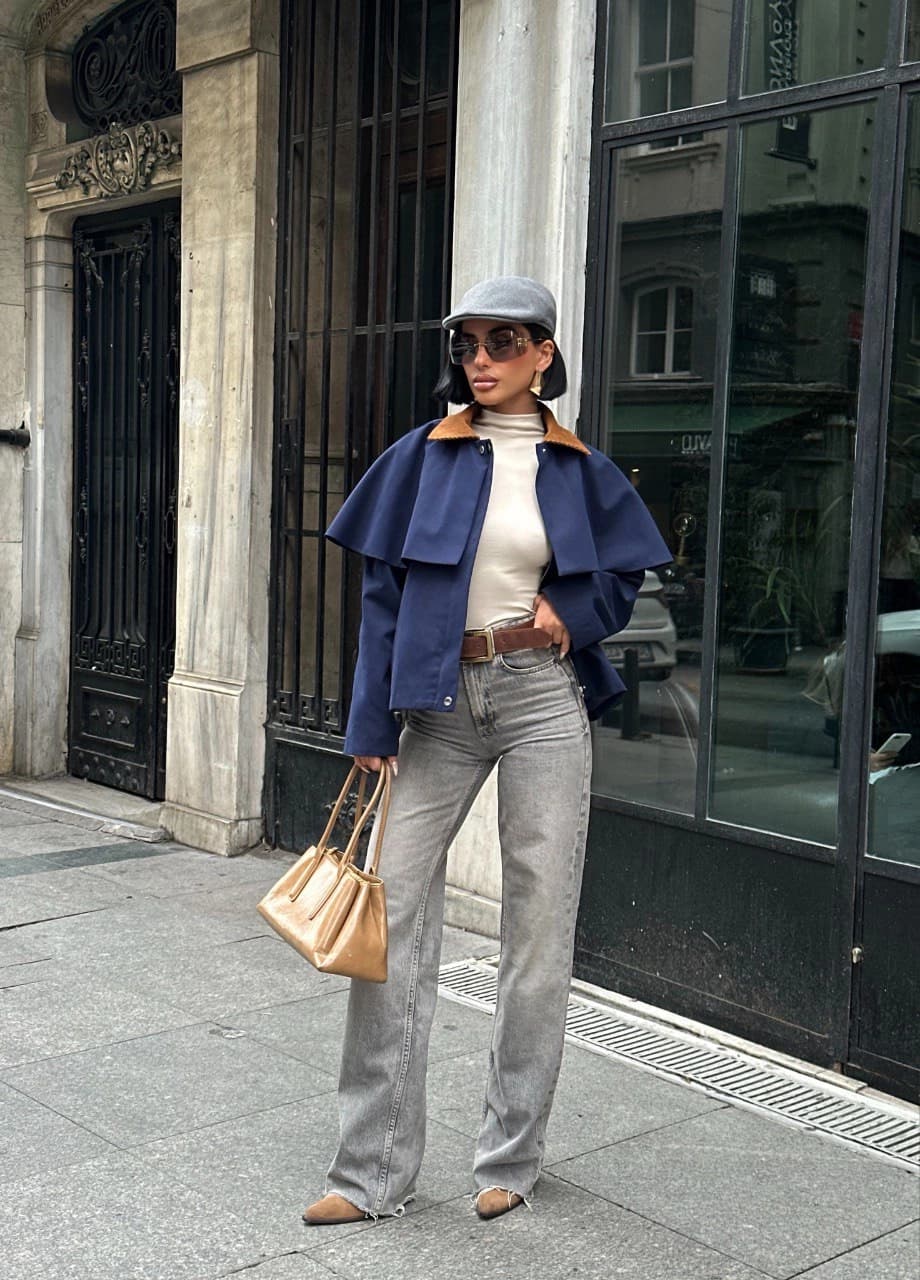 Chic navy blue belted cape jacket with a luxe brown suede collar. Women's wool blend fall coat featuring stylish snap...