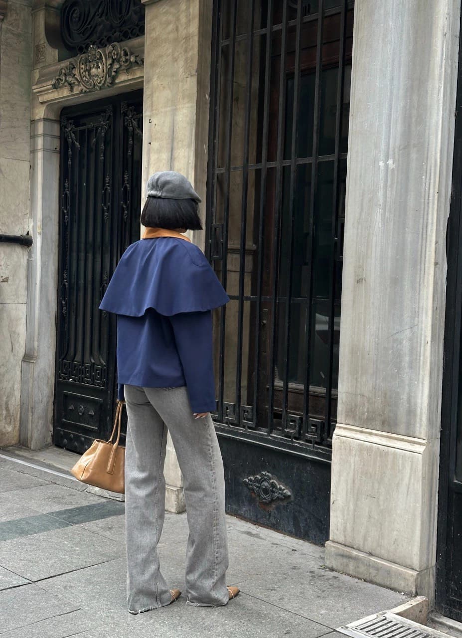 Navy Blue Wool Blend women's fall coat, viewed from behind, flaunting its signature layered shoulder and warm suede n...