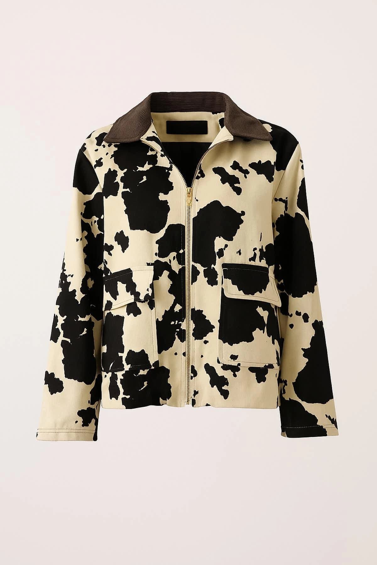 Womens cow print utility jacket, beige and black, brown corduroy collar, front zipper, two flap chest pockets.