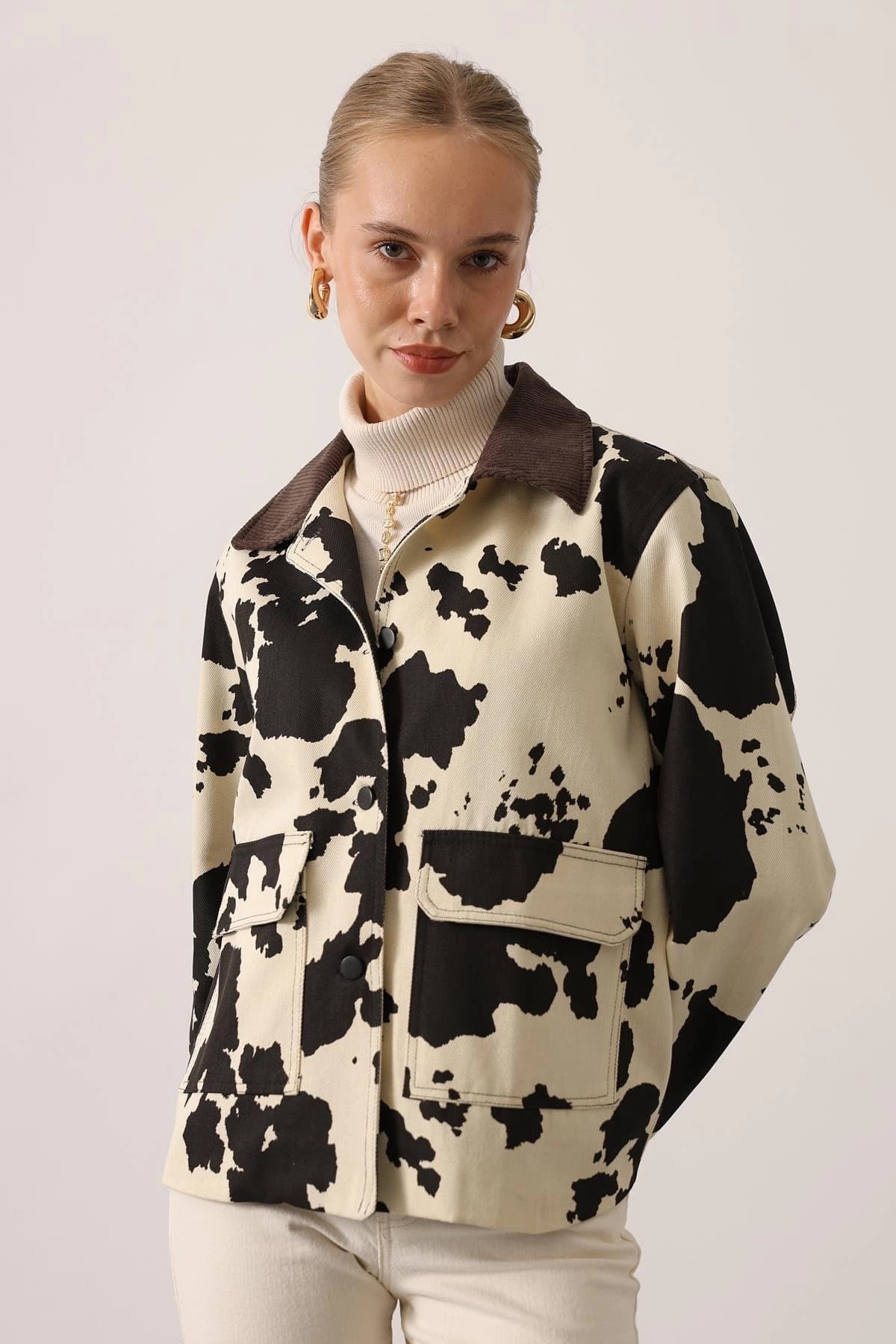 Vanilla casual coat with charcoal splotches, russet ridged collar, and frontal cargo pouches.