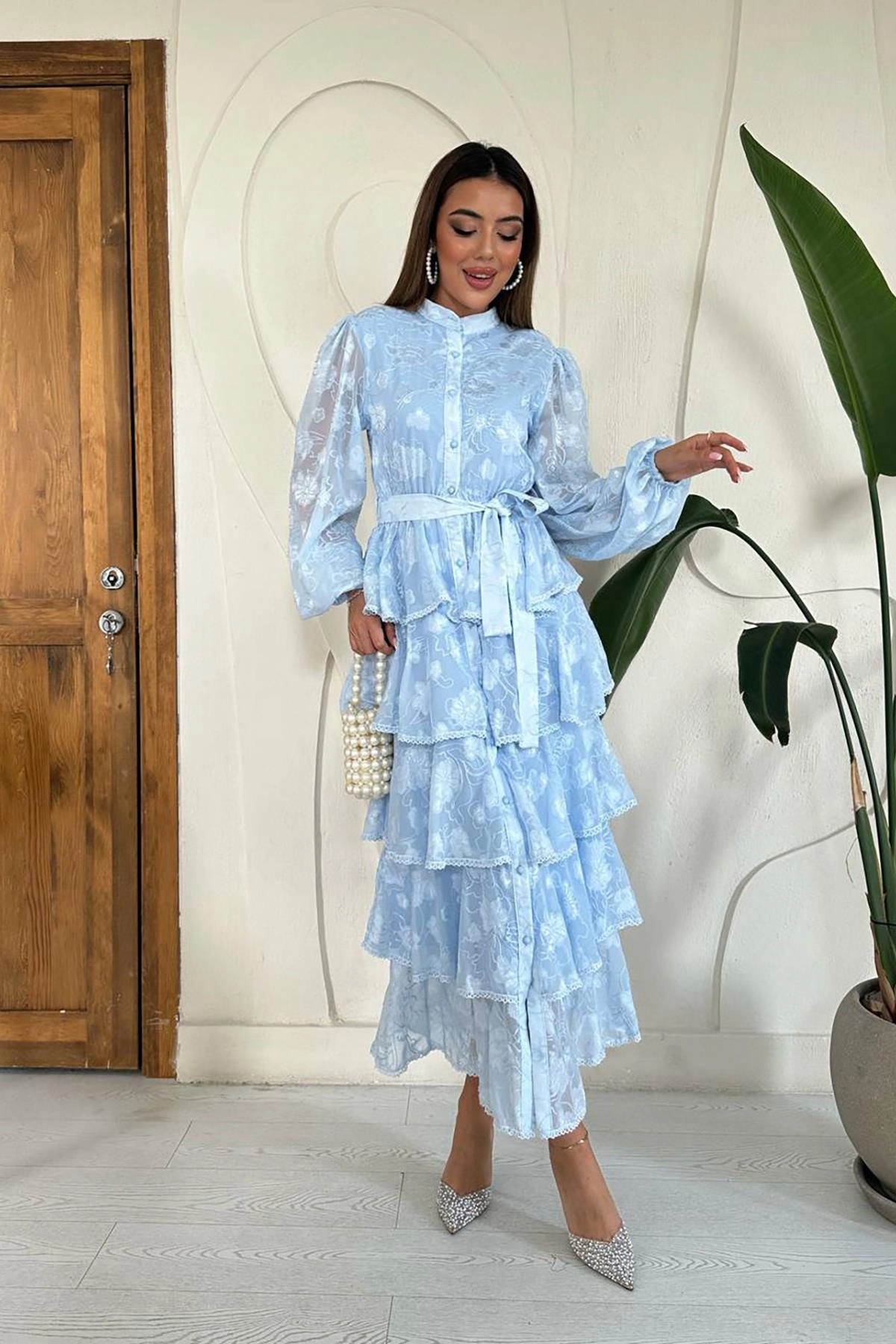 Elegant Layers of Blue: The Dress That Defines Grace 